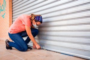 A lady checking the garage door