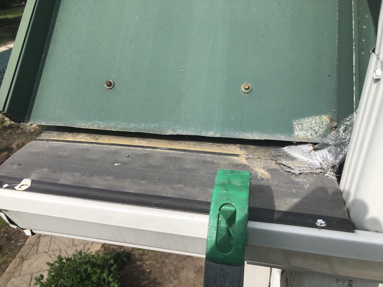 Gutter cleaning process with a tool